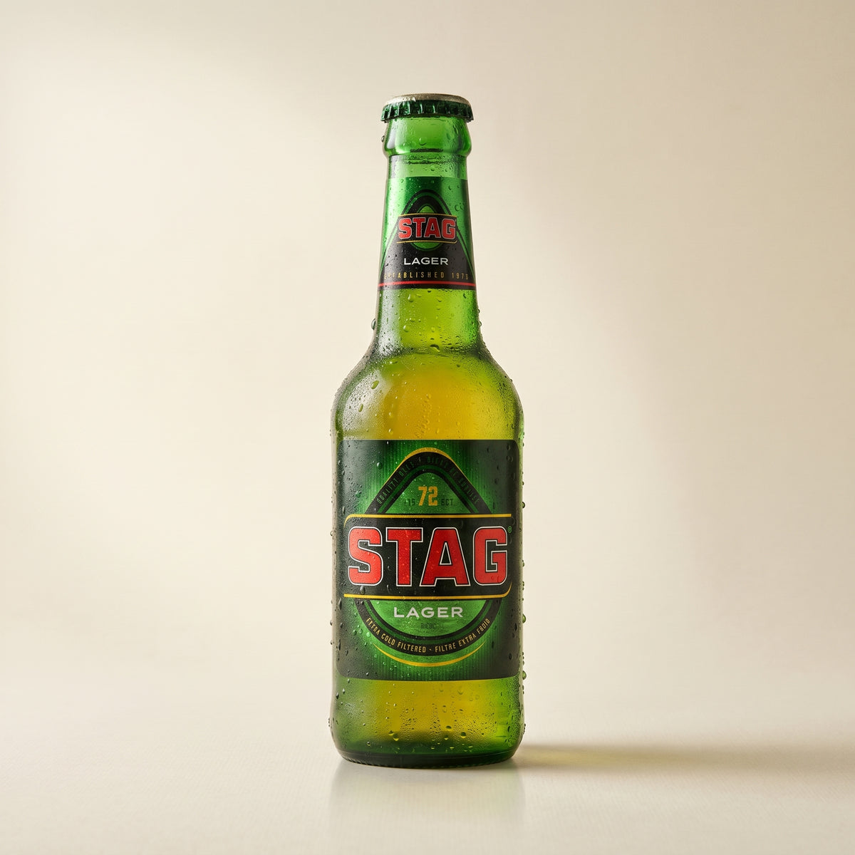 Stag Lager bottle on a bone studio surface